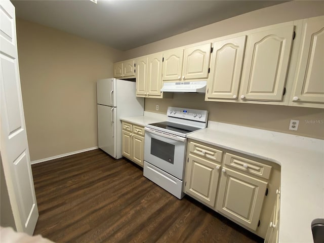 kitchen with dark hardwood / wood-style floors, white appliances, and white cabinetry