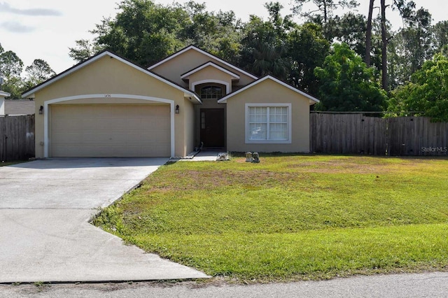 ranch-style house featuring a garage and a front yard