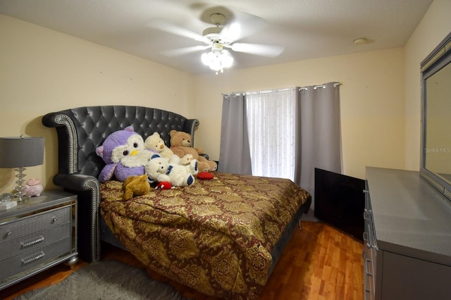 bedroom featuring dark hardwood / wood-style floors and ceiling fan