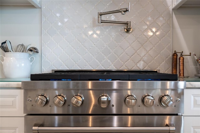 room details with stove and tasteful backsplash