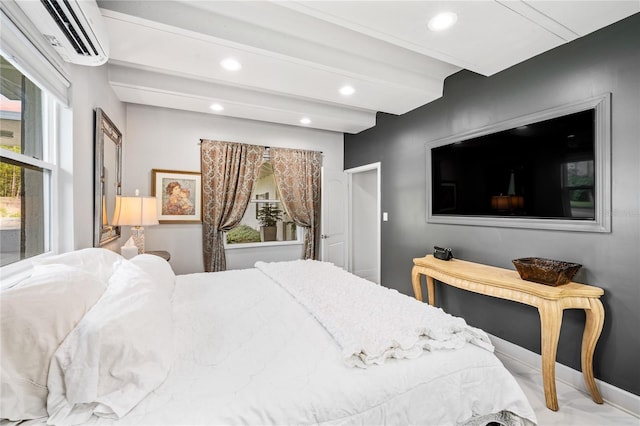 bedroom featuring a wall mounted AC