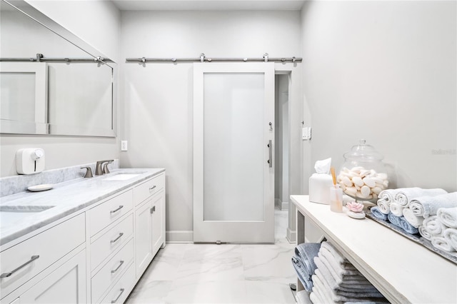 bathroom with double vanity and tile floors