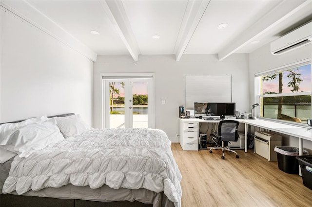 bedroom featuring light hardwood / wood-style floors, french doors, beamed ceiling, an AC wall unit, and access to outside