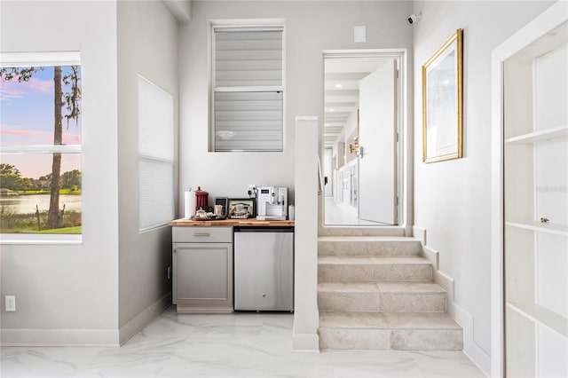 stairs featuring light tile flooring