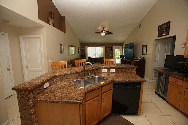 kitchen with dishwasher, ceiling fan, sink, and lofted ceiling