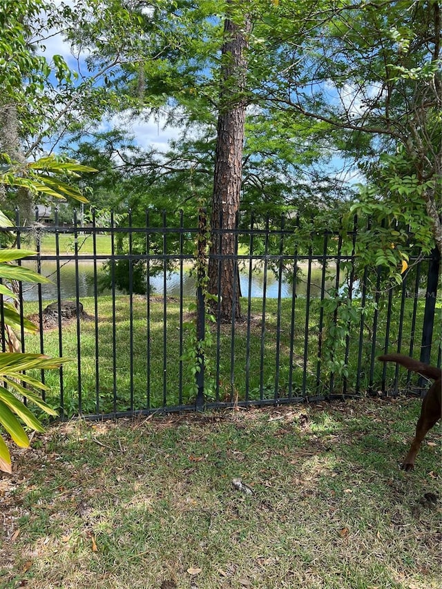 1201 Thornbury Ct, Winter Garden, FL 34787 - view of gate with fence and a water view