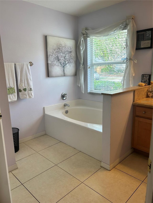 1201 Thornbury Ct, Winter Garden, FL 34787 - bathroom featuring tile patterned floors, a garden tub, and vanity