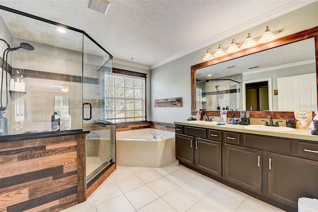 bathroom featuring tile flooring, a textured ceiling, dual bowl vanity, and separate shower and tub