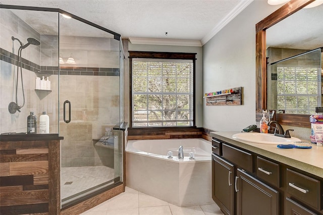 bathroom with a textured ceiling, plus walk in shower, vanity, and tile flooring