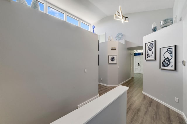 hallway with hardwood / wood-style floors