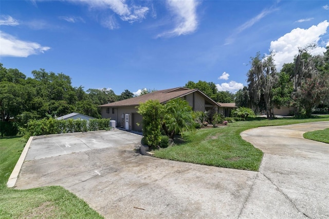 view of side of home featuring a yard