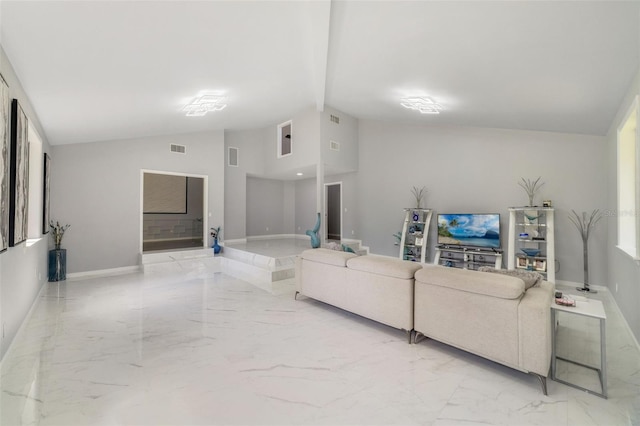 living room featuring vaulted ceiling