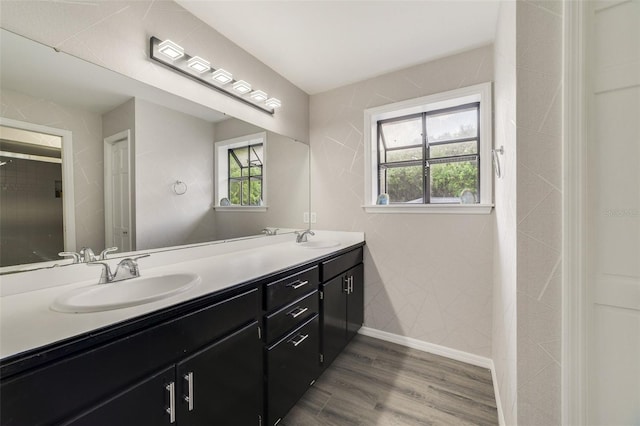 bathroom with vanity and wood-type flooring