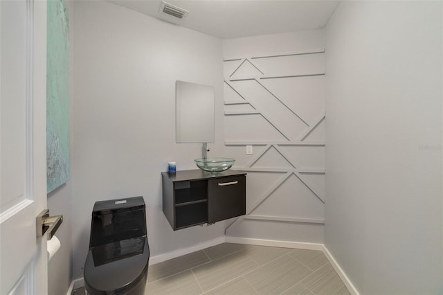 bathroom featuring vanity and heating unit