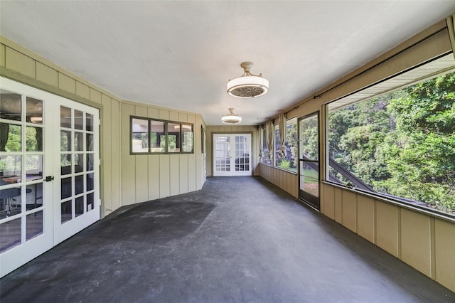 unfurnished sunroom with french doors