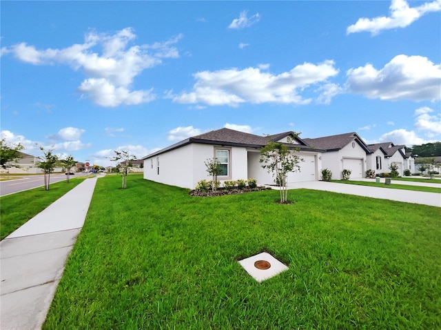 single story home with a garage and a front yard