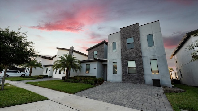 modern home with a lawn