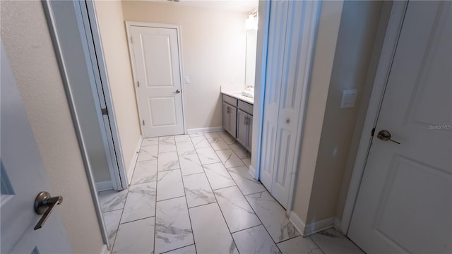 bathroom with tile flooring and vanity