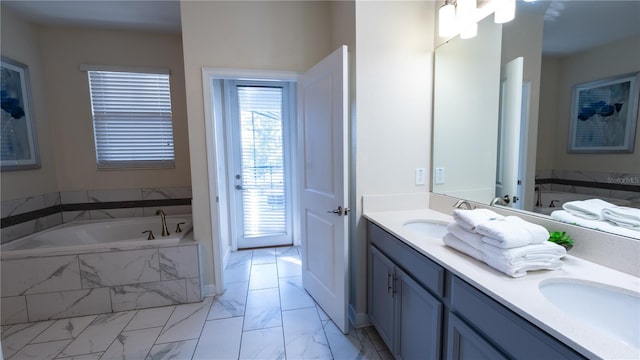 bathroom with double vanity, tiled tub, and tile floors