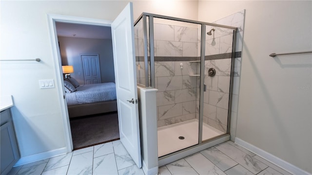 bathroom featuring tile floors, a shower with shower door, and vanity