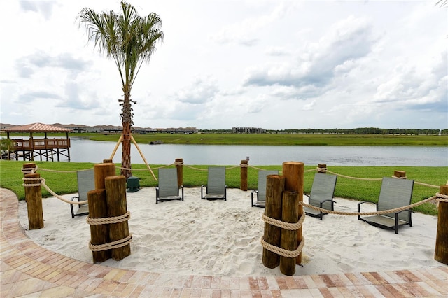 view of patio / terrace with a gazebo and a water view