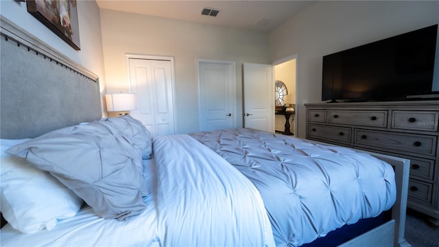 carpeted bedroom featuring a closet