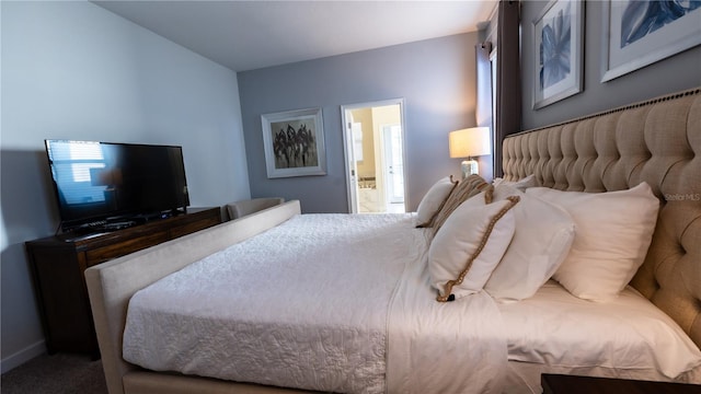 carpeted bedroom featuring ensuite bathroom