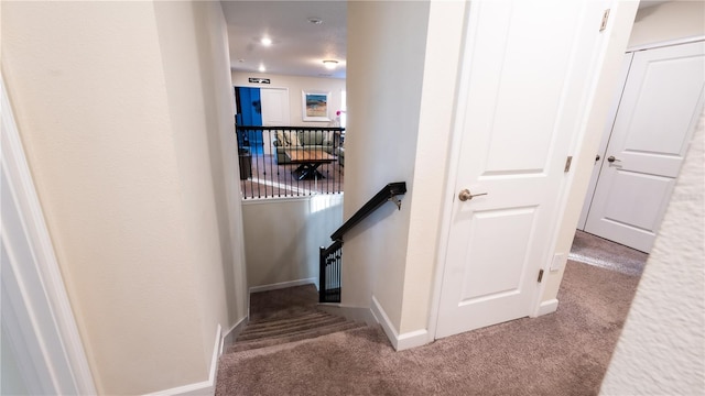 hallway featuring carpet