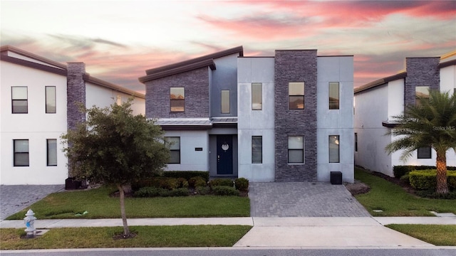 contemporary home with a yard