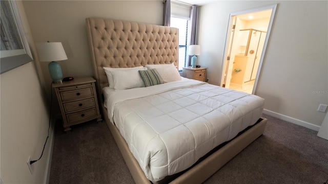 carpeted bedroom featuring ensuite bathroom