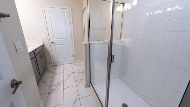 bathroom featuring tile floors, a shower with shower door, and vanity