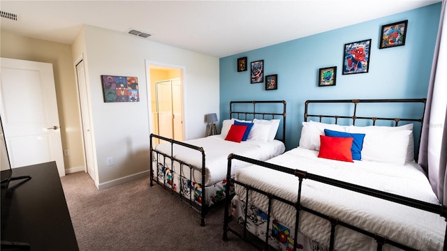 bedroom with a closet and carpet floors