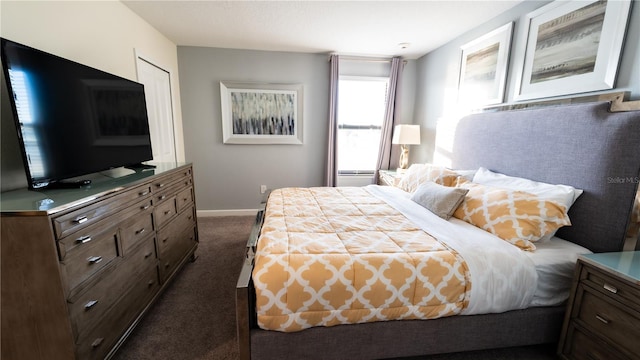 bedroom with dark carpet