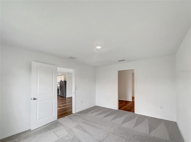 empty room featuring carpet flooring