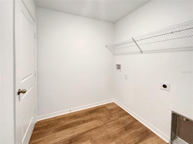 laundry area with hookup for an electric dryer, wood-type flooring, and washer hookup