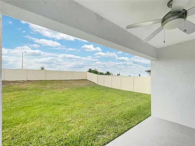 view of yard with ceiling fan