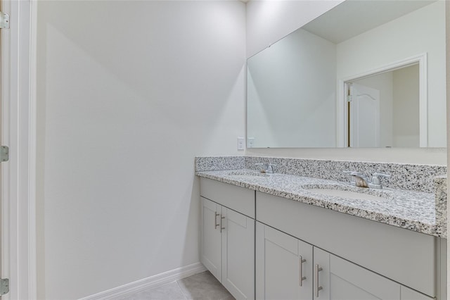 bathroom featuring tile flooring and vanity