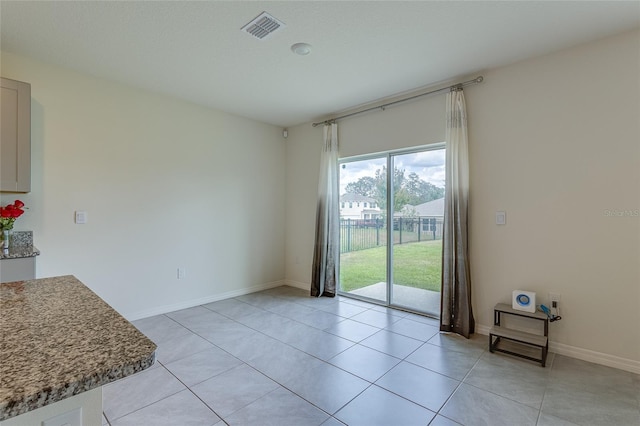 view of tiled spare room