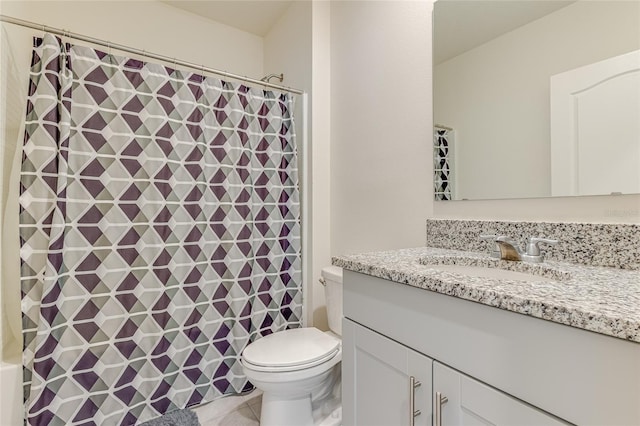 bathroom featuring tile flooring, oversized vanity, and toilet