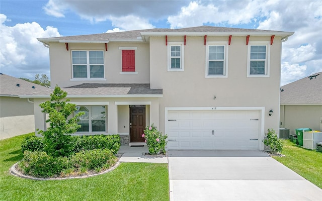 view of front of house with a garage, central AC, and a front yard