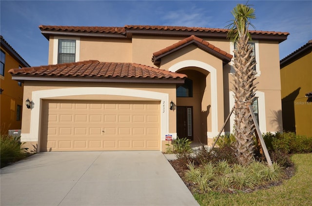 mediterranean / spanish-style house featuring a garage