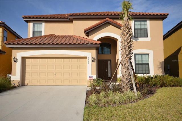 mediterranean / spanish home featuring a front lawn