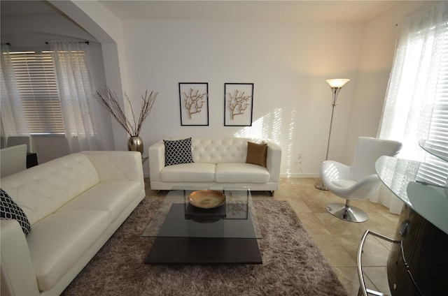 living room with a healthy amount of sunlight and tile floors