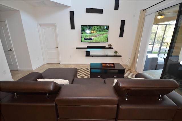 tiled living room with ceiling fan