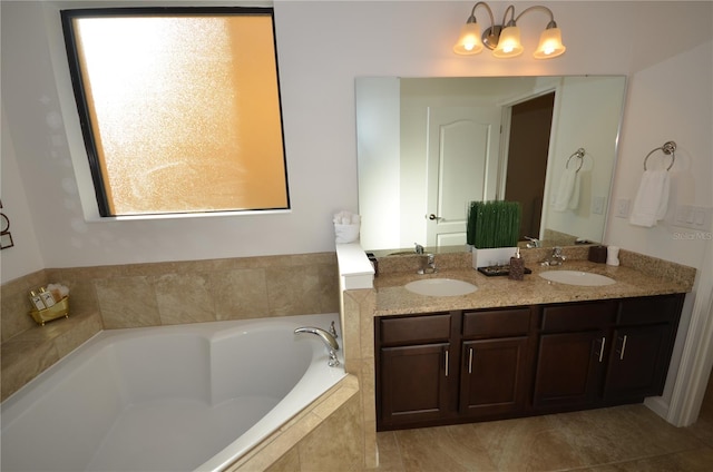 bathroom with tiled bath, tile floors, and dual bowl vanity