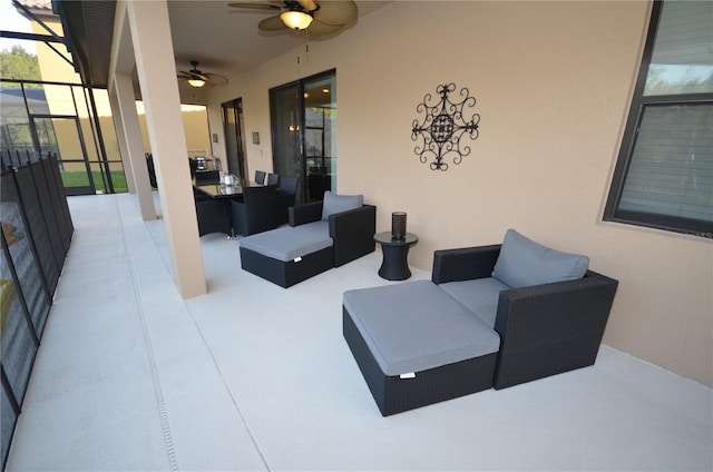 view of patio with outdoor lounge area and ceiling fan