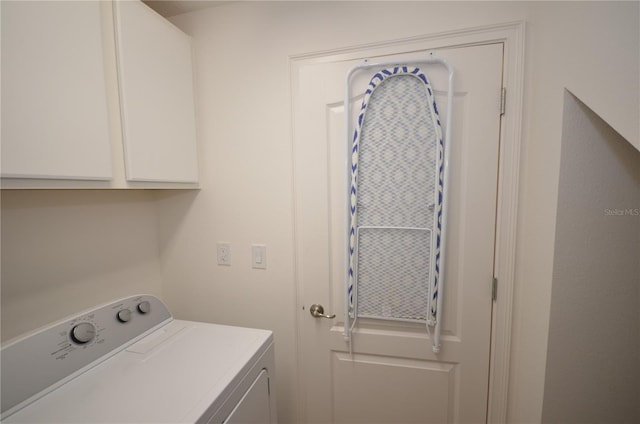 laundry area with cabinets and washer / clothes dryer