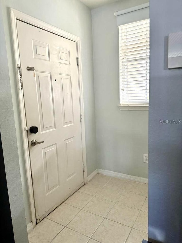 entryway featuring light tile patterned floors