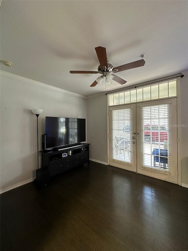 unfurnished living room featuring dark hardwood / wood-style flooring, a textured ceiling, ceiling fan, and crown molding