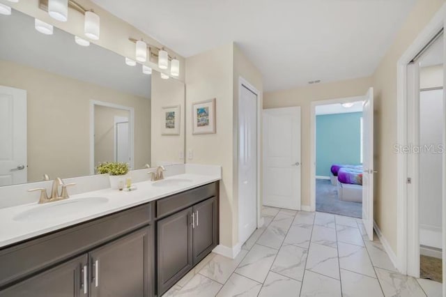 bathroom with tile flooring and double sink vanity